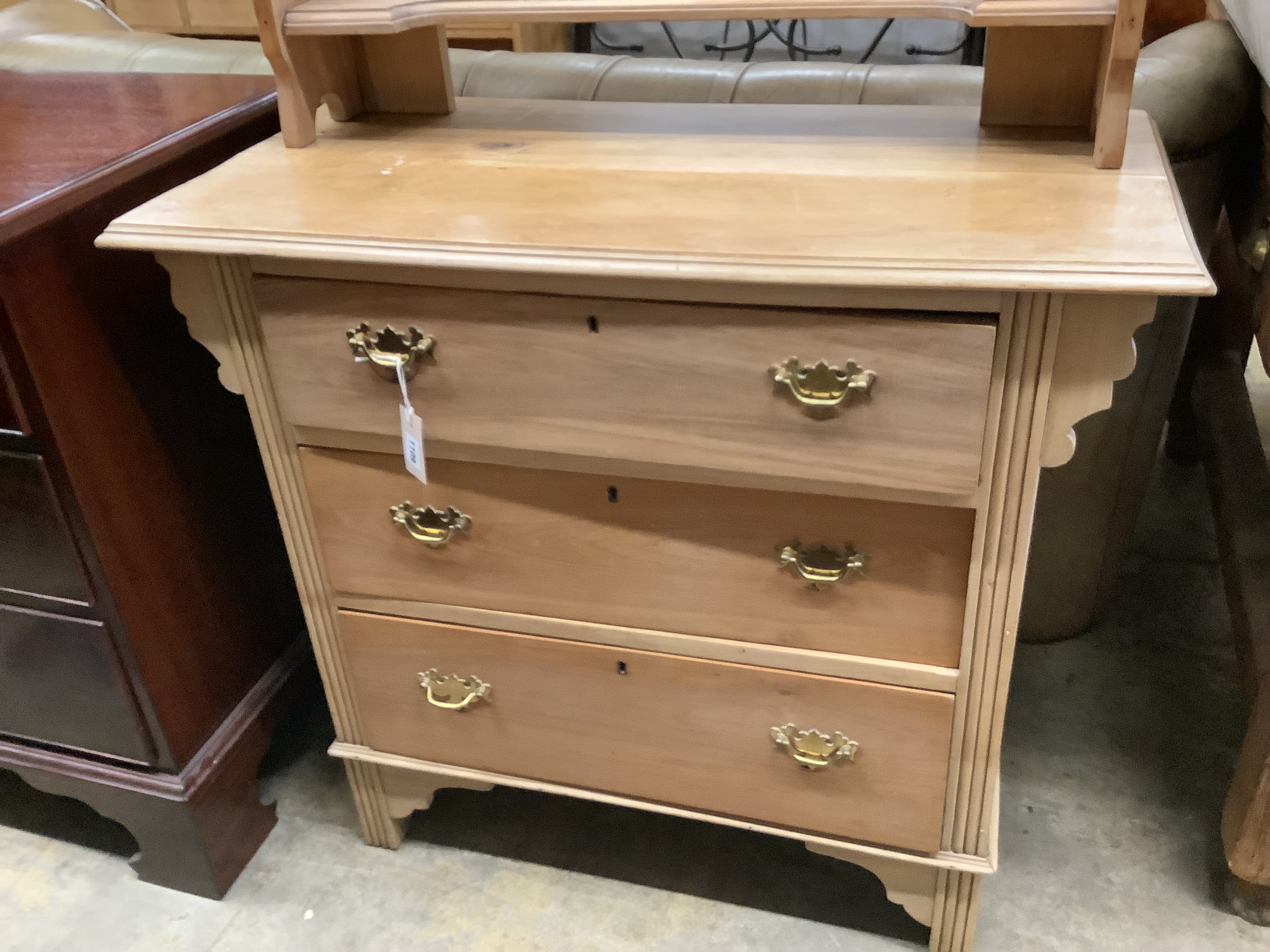 A late Victorian satin walnut dressing chest with swing mirror, width 91cm, depth 45cm, height 150cm